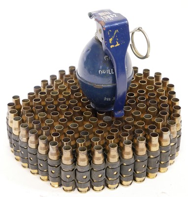 Lot 211 - Machine gun belt of 7.62 fired cases, one...