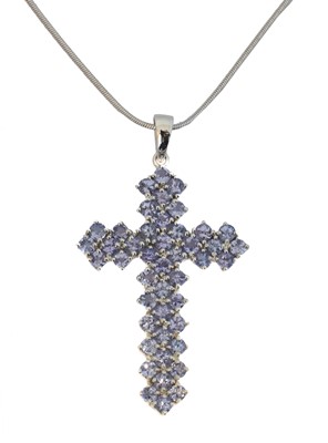 Lot 34 - A 9ct gold tanzanite cross pendant.