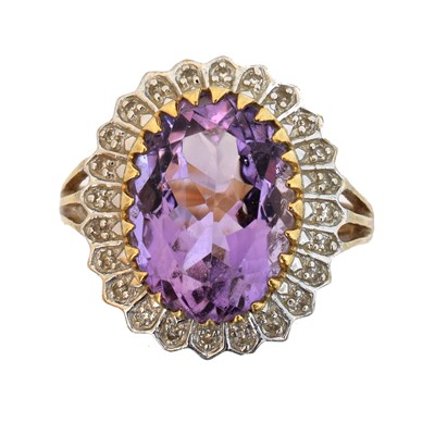 Lot 82 - A 9ct gold amethyst and diamond cluster ring.