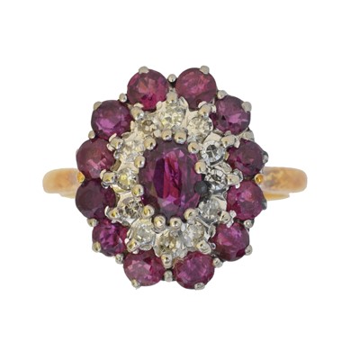 Lot 114 - A ruby and diamond cluster ring.