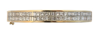 Lot 31 - A diamond hinged bangle.