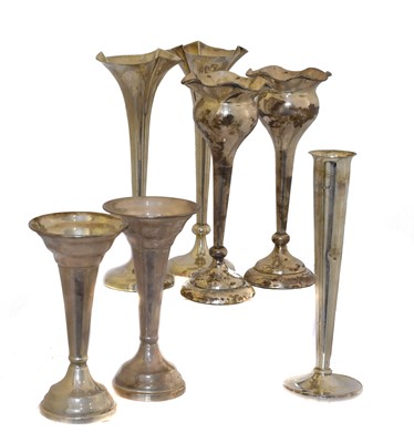 Lot 16 - Seven silver fluted vases.