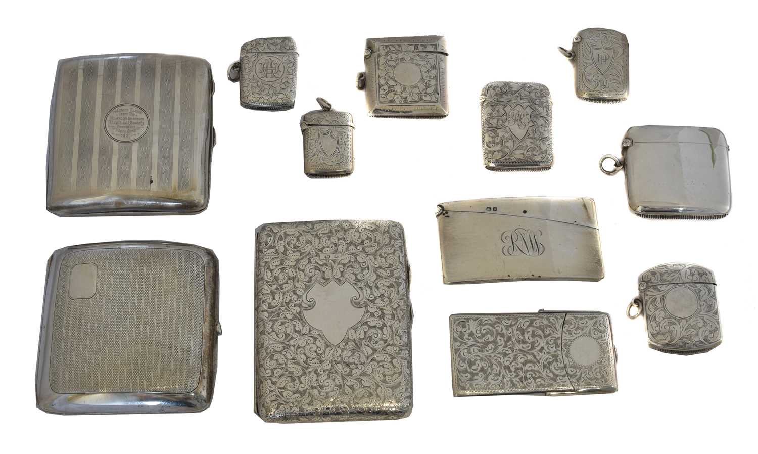 Lot 42 - A selection of silver vesta and card cases.