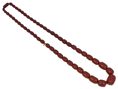 Lot 89 - A cherry amber bead necklace.