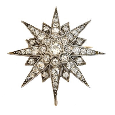Lot 15 - A diamond star brooch.