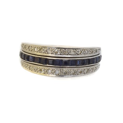 Lot 155 - A sapphire, ruby and diamond swivel band ring.