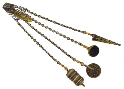 Lot 98 - An early 20th century brass chatelaine.