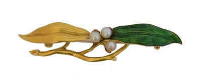 Lot 4 - An early 20th century enamel and seed pearl brooch.