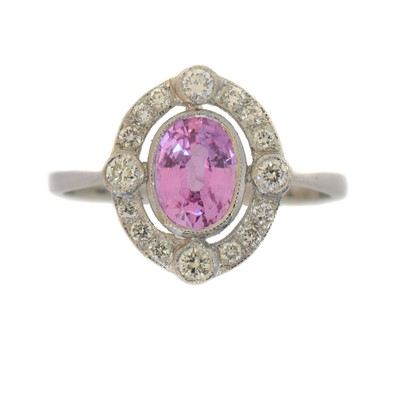 Lot 184 - A sapphire and diamond dress ring.