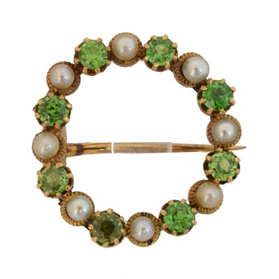Lot 16 - An early 20th century demantoid garnet and split pearl wreath brooch.