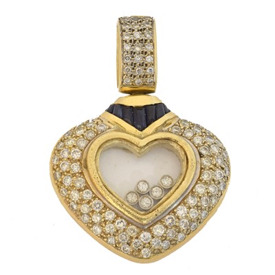 Lot 68 - A diamond and sapphire heart pendant.