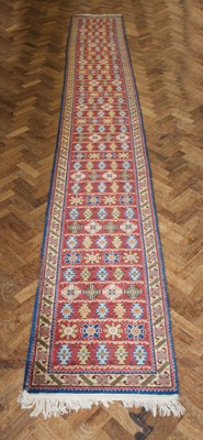 Lot 161 - A Very Long Bokhara-Type Runner