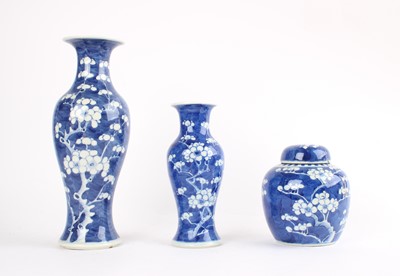 Lot 322 - Two Graduated Chinese Blue and White "Prunus" Vases and a Ginger Jar