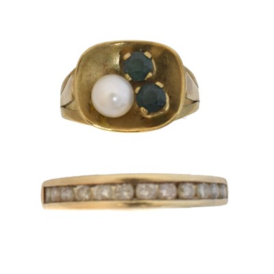 Lot 57 - Two gem-set dress rings.