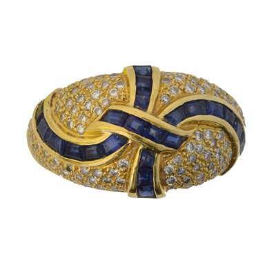 Lot 157 - A gold sapphire and diamond bombe ring.