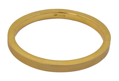 Lot 44 - A 1920s 9ct gold bangle by Nathan Brothers.