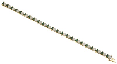 Lot 28 - A 9ct gold emerald and cultured pearl bracelet.