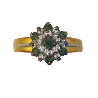 Lot 144 - An emerald and diamond cluster ring.