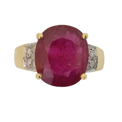 Lot 90 - An 18ct gold glass filled ruby and diamond dress ring.