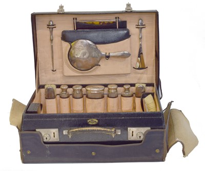 Lot 47 - A George V silver mounted travelling dressing table set.