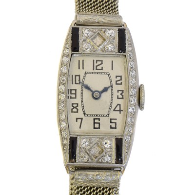 Lot 173 - An early 20th century French platinum cocktail watch.