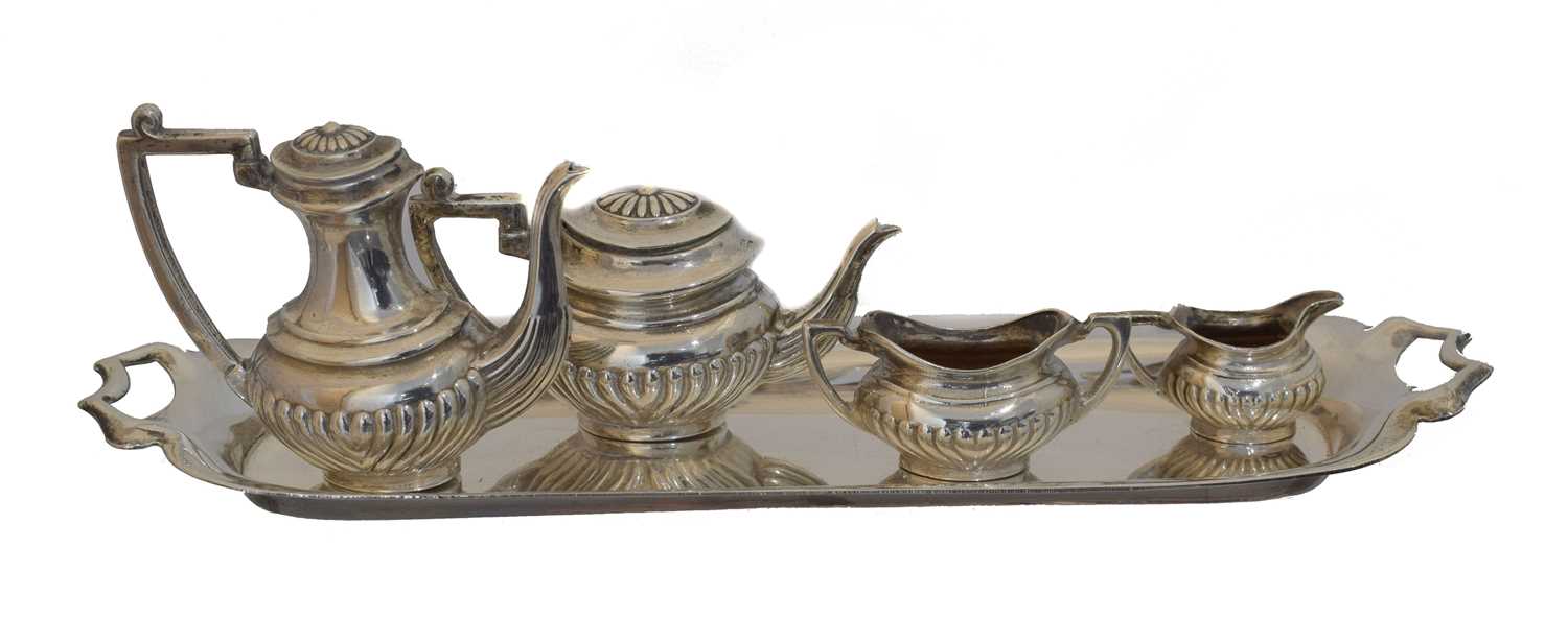 Lot 34 - A novelty miniature silver four piece tea set.