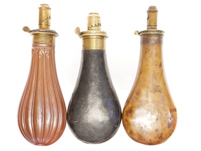 Lot 380 - Three copper and brass powder flasks, one...