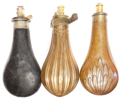 Lot 381 - Three copper and brass powder flasks, two...