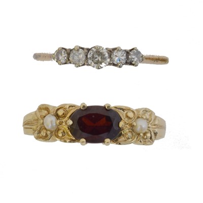 Lot 60 - Two gem-set dress rings.