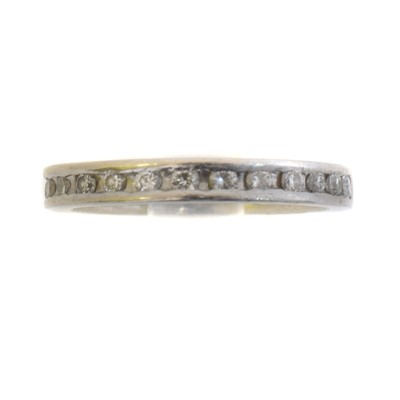 Lot 149 - A platinum diamond band ring.