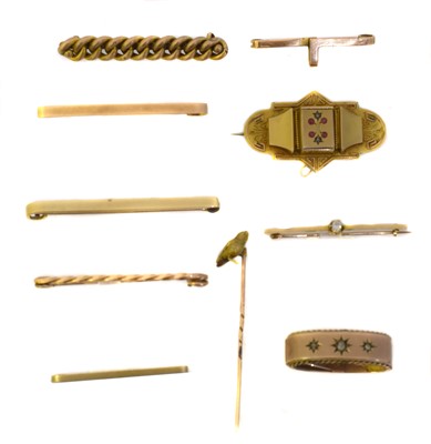 Lot 21 - A selection of 9 and 15ct gold brooches and stick pins.