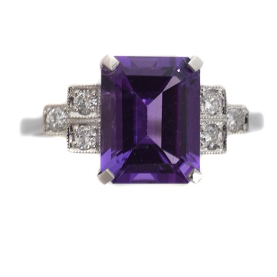 Lot 155 - An amethyst and diamond dress ring.