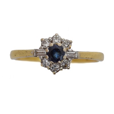 Lot 142 - An 18ct gold sapphire and diamond cluster ring by Cropp & Farr.