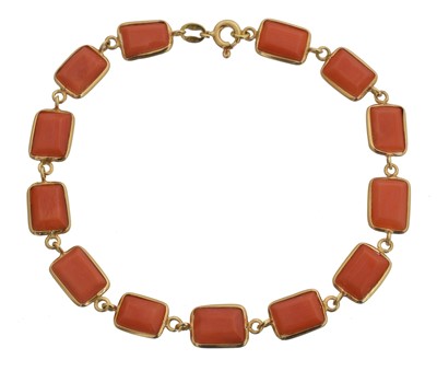 Lot 4 - An 18ct gold coral bracelet.