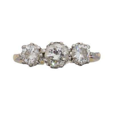 Lot 141 - A diamond three stone ring.
