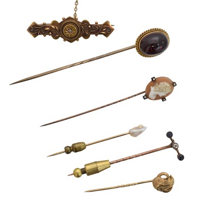 Lot 3 - A selection of stick pins and brooches.