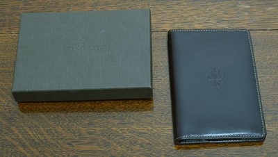 Lot 256 - Patek Philippe - A leather mini notebook.