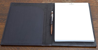 Lot 257 - Patek Philippe - A leather bound notebook.