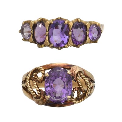 Lot 140 - Two amethyst dress rings.