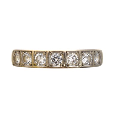 Lot 134 - An 18ct gold diamond band ring.