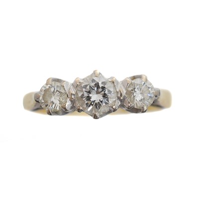 Lot 130 - An 18ct gold diamond three stone ring.