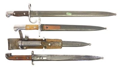 Lot 161 - Four bayonets and scabbards, to include a...