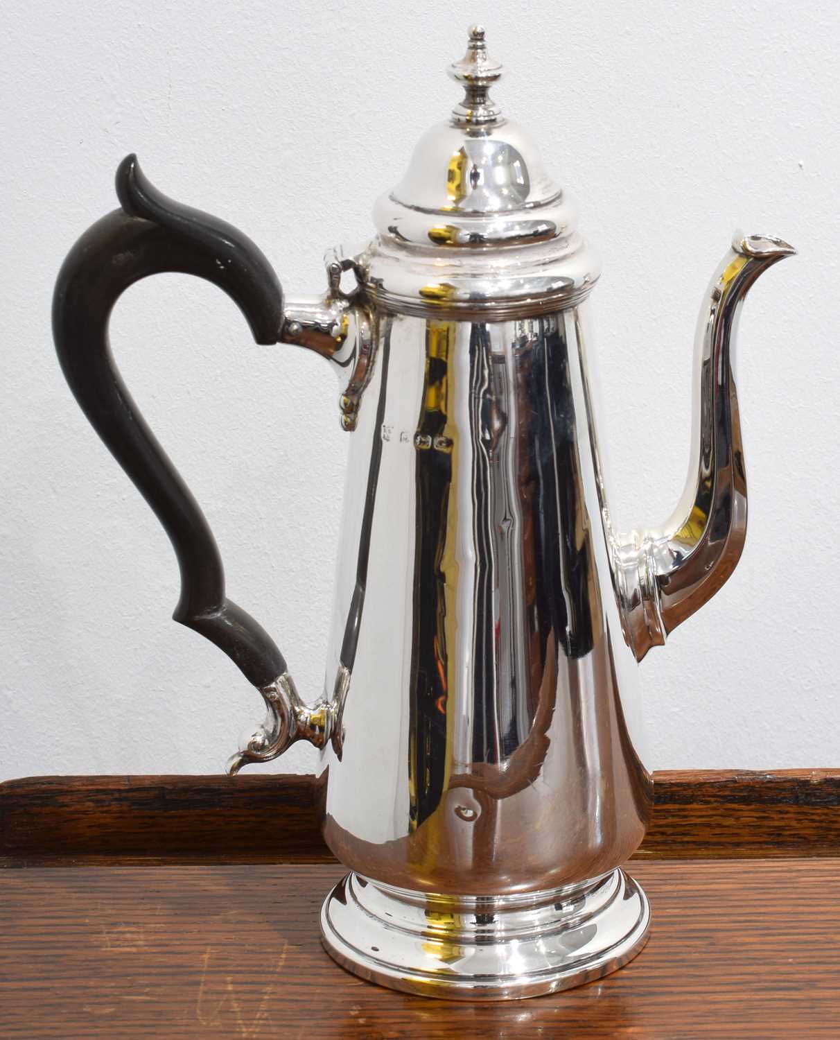 Lot 107 - A George V silver hot water jug.