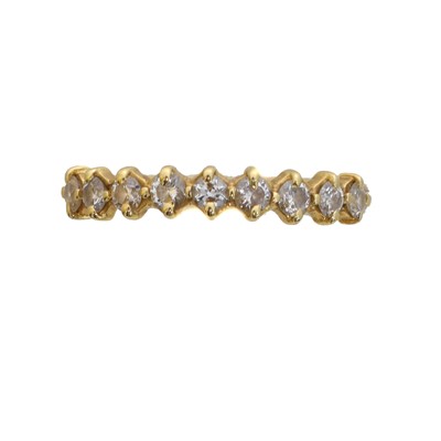 Lot 103 - A diamond band ring.