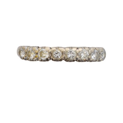 Lot 109 - A diamond band ring.