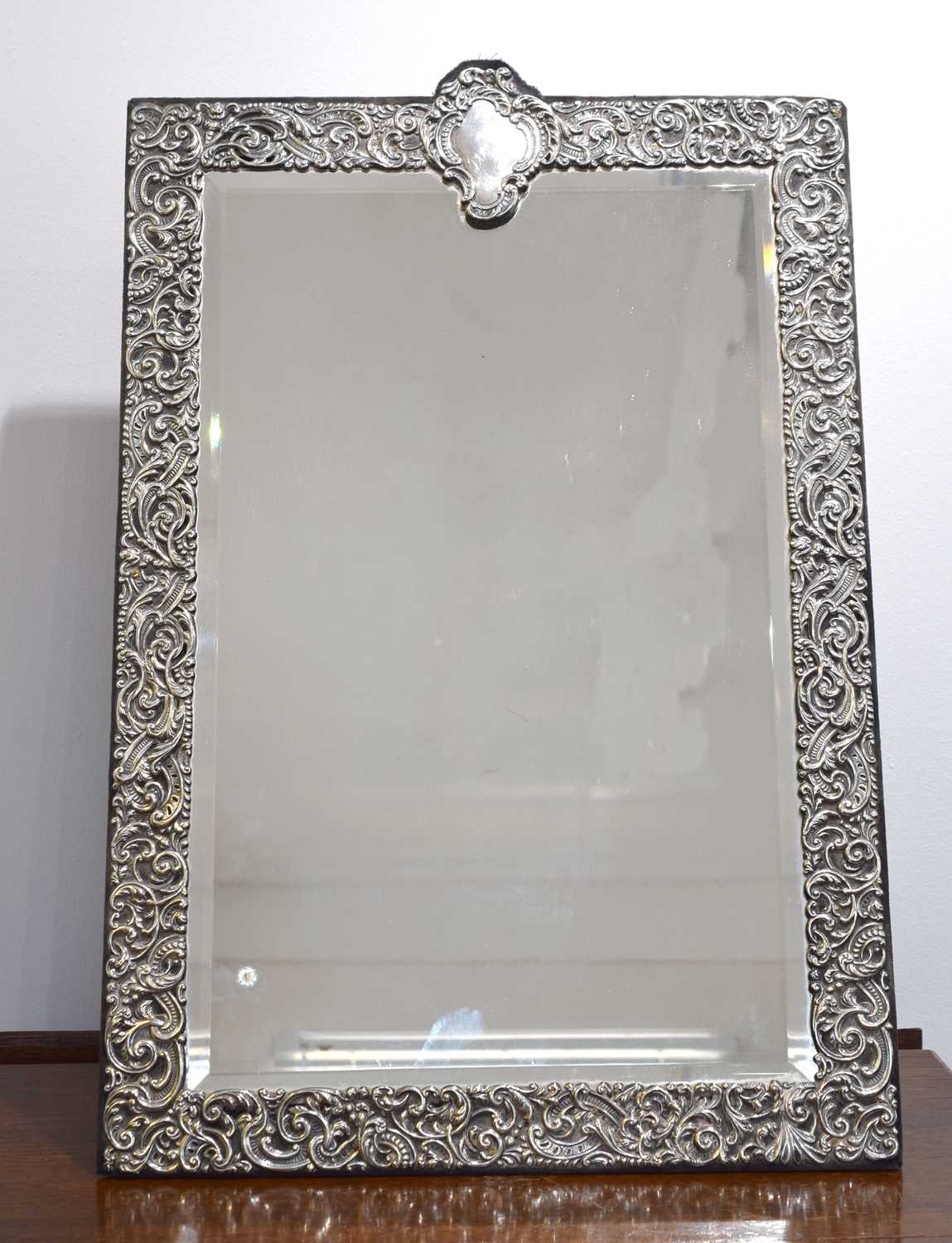 Lot 91 - A late Victorian silver fronted mirror by Goldsmiths.