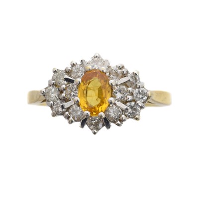 Lot 87 - An 18ct gold sapphire and diamond cluster ring.
