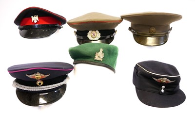 Lot 213 - Four peaked caps, two Russian, one with 1st...