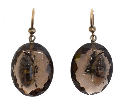 Lot 43 - A pair of smoky quartz bug drop earrings.
