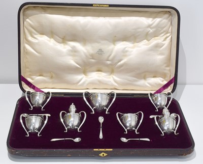 Lot 83 - A large cased silver cruet set with presentation plaque.